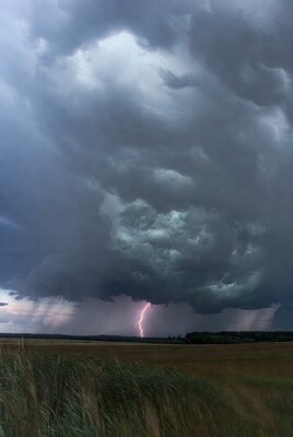 Lightning strike over stormy field