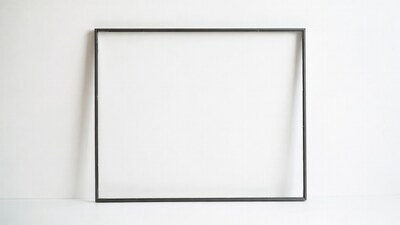 Black picture frame on white wall