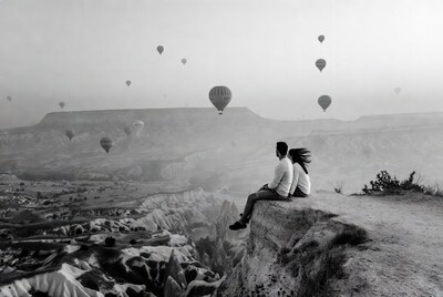Couple watching hot air balloons