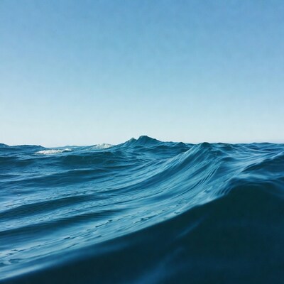 Ocean waves under blue sky