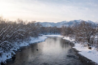 Snowy river in winter mountains