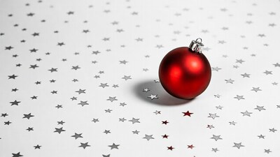 Red Christmas ornament on star background