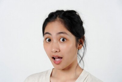Asian woman with surprised expression