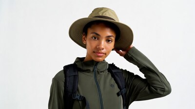 Woman wearing hiking hat and backpack