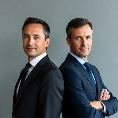 Two businessmen standing back to back