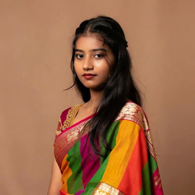 Young woman in colorful sari
