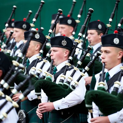 Bagpipe band in traditional Scottish attire