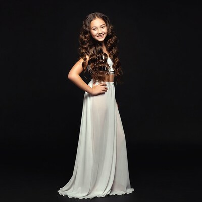 Girl in white dress smiling