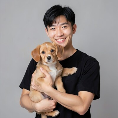 Asian Man Smiling with Puppy