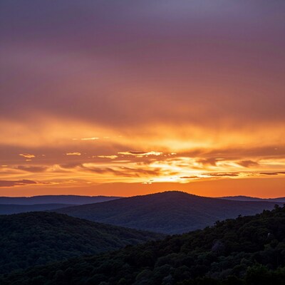 Sunset Over Forested Mountains