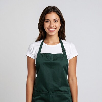 Smiling woman in green apron