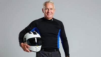 Smiling older man with motorcycle helmet