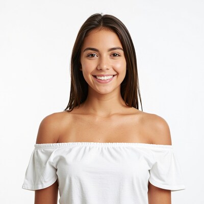Smiling young woman in white off-shoulder top