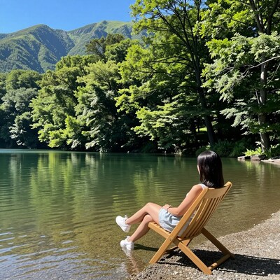 Woman Relaxing by Mountain Lake