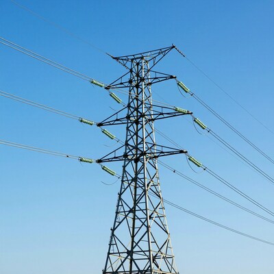 Electricity Pylon Against Blue Sky