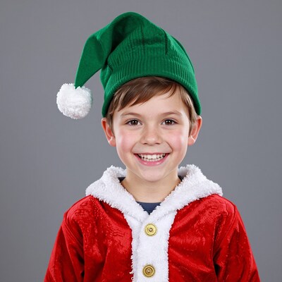 Smiling boy in Christmas elf costume