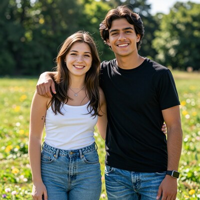 Young couple smiling in meadow