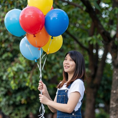 Asian girl with colorful balloons