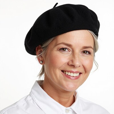 Smiling woman in black beret