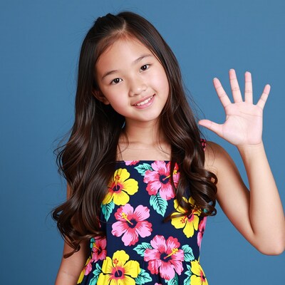 Young Asian girl waving