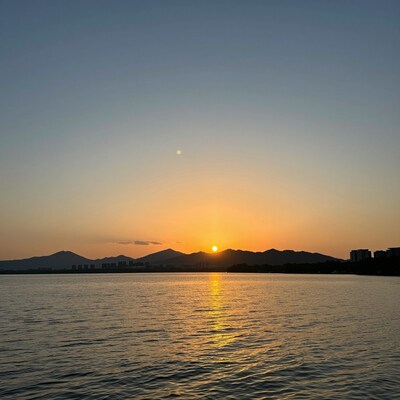Sunset over Lake and Mountains