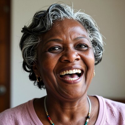 Happy elderly Black woman laughing