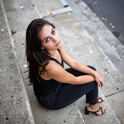 Young woman sitting on concrete steps