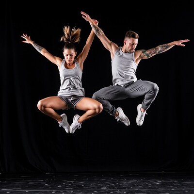 Man and Woman Jumping in Sync