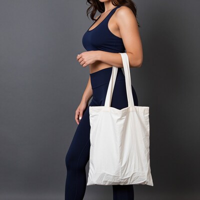 Woman Holding White Tote Bag