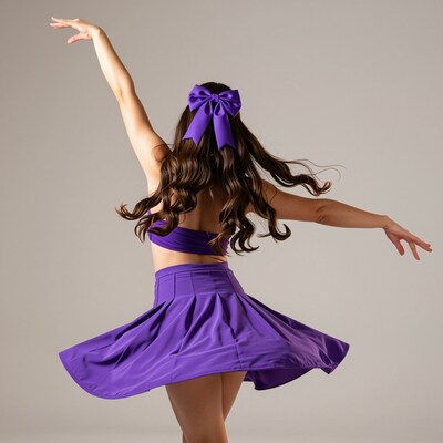 Woman dancing in purple outfit