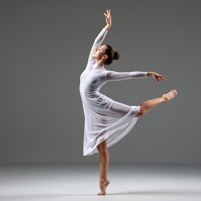 Ballerina in white dress dancing