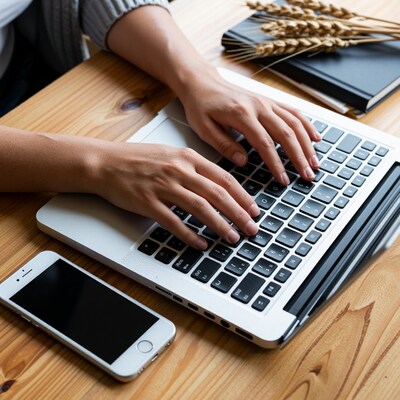 Woman typing on laptop