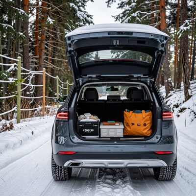 SUV trunk with winter gear in snowy forest