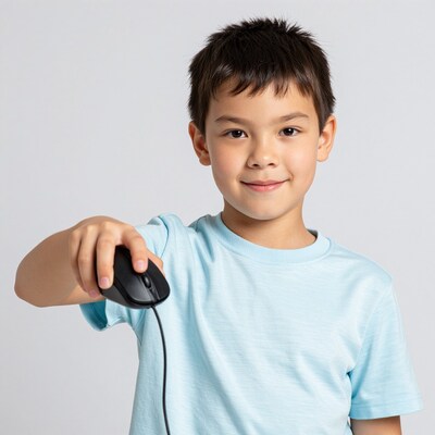 Young boy holding computer mouse