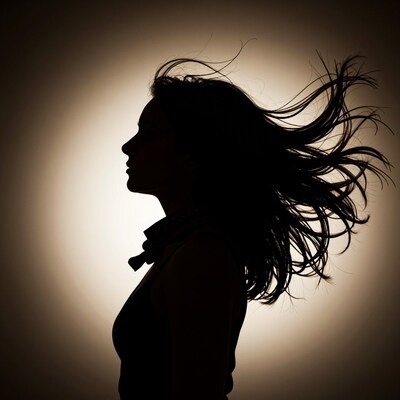 Woman silhouette with flowing hair