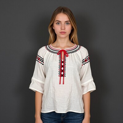Woman in white embroidered blouse