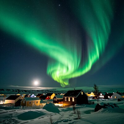 Aurora Borealis over snowy village