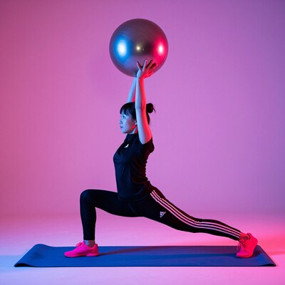 Woman with Exercise Ball in Lunge Pose