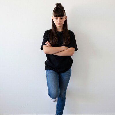 Young woman with half-shaved undercut and top knot