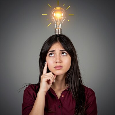 Woman thinking with lightbulb idea