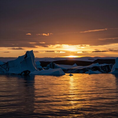 Arctic sunset over icebergs