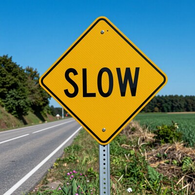 Yellow Slow Road Sign