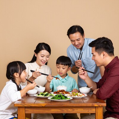 Asian family eating Chinese dinner