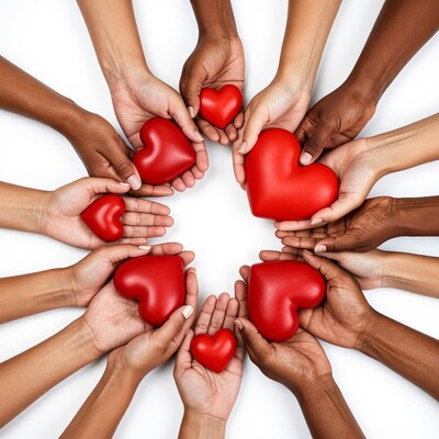 Diverse hands holding red hearts