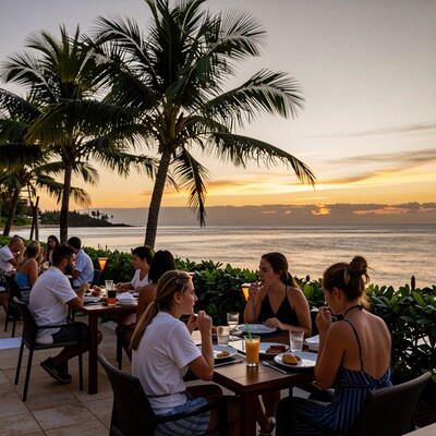 Friends dining at tropical beach sunset