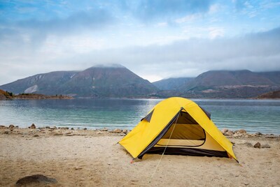 Yellow Camping Tent on Lakeside Beach