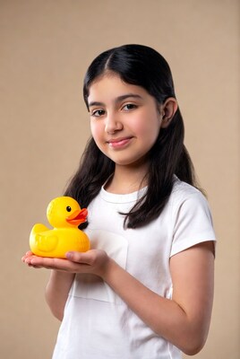 Girl holding yellow rubber duck