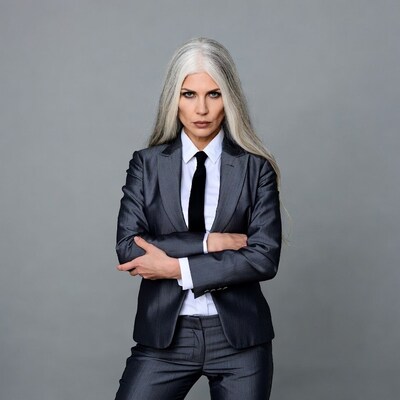 Woman with white hair in suit