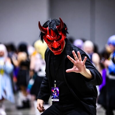 Man in red oni demon mask