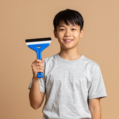Smiling Asian boy with squeegee